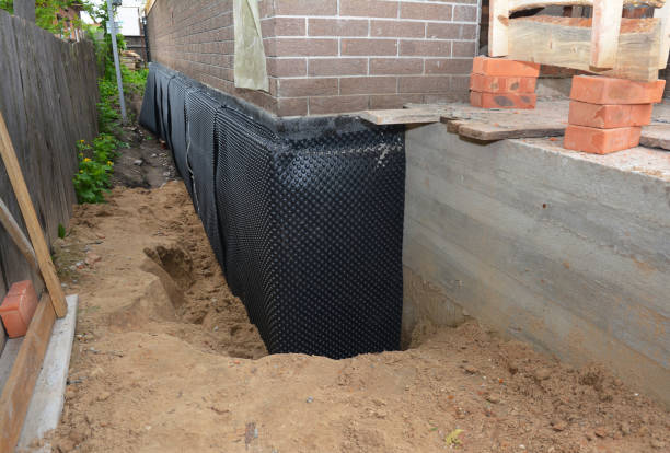 Happy homeowners after waterproofing job in Fords